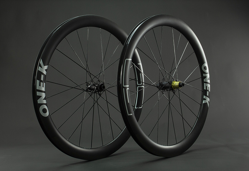 ONE-K | Ultra-lightweight carbon wheels for road bikes and gravel bikes.